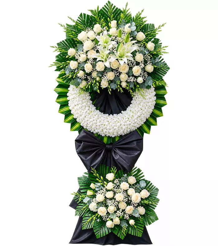Thành Kính – kệ hoa phân ưu trắng nơ đen